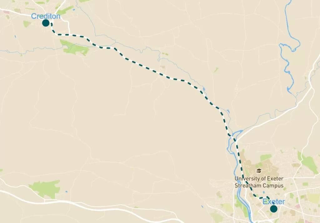 Map showing a route from Crediton to Exeter. The path is indicated by a dotted line.
