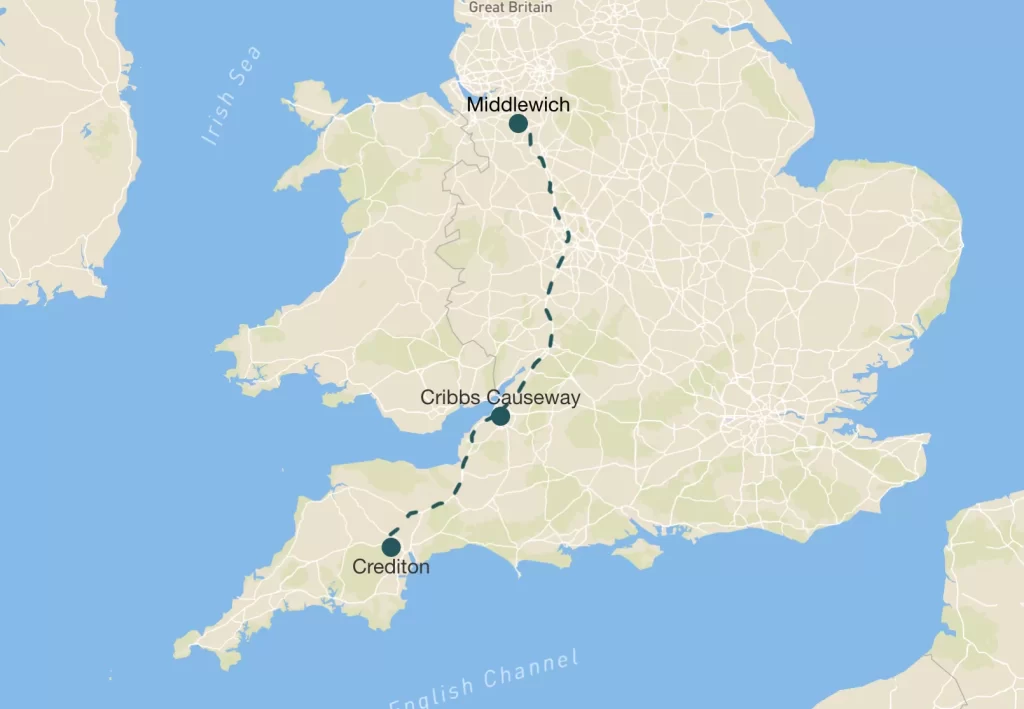 Map showing a route in England, connecting the locations of Middlewich and Cheddar, with a dashed line indicating the path. The map includes geographical features and bodies of water.
