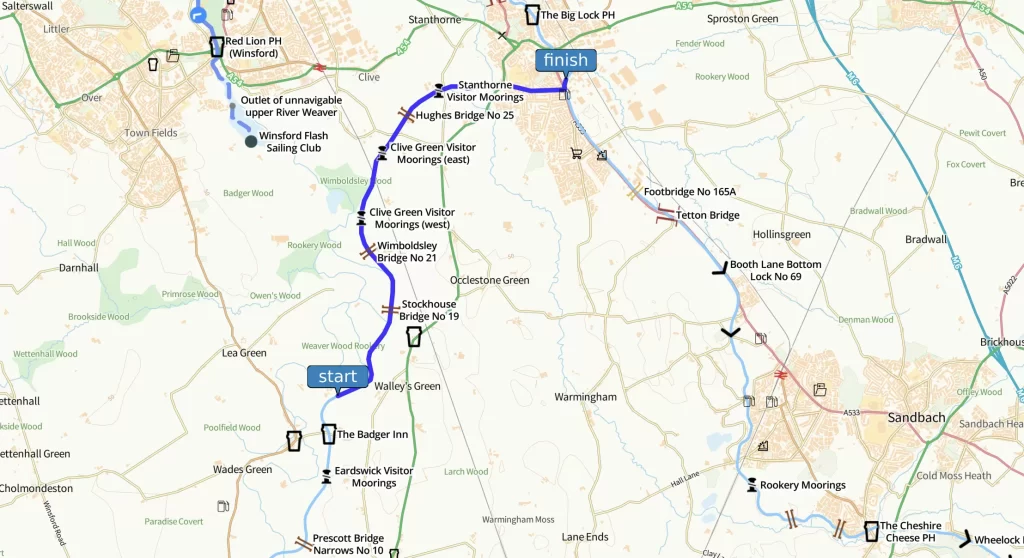A map showing a route from the town of Market Harborough to the town of Kettering, marked with a blue line. Nearby landmarks, roads, and points of interest are labeled along the route, providing context for navigation between the two towns in England.